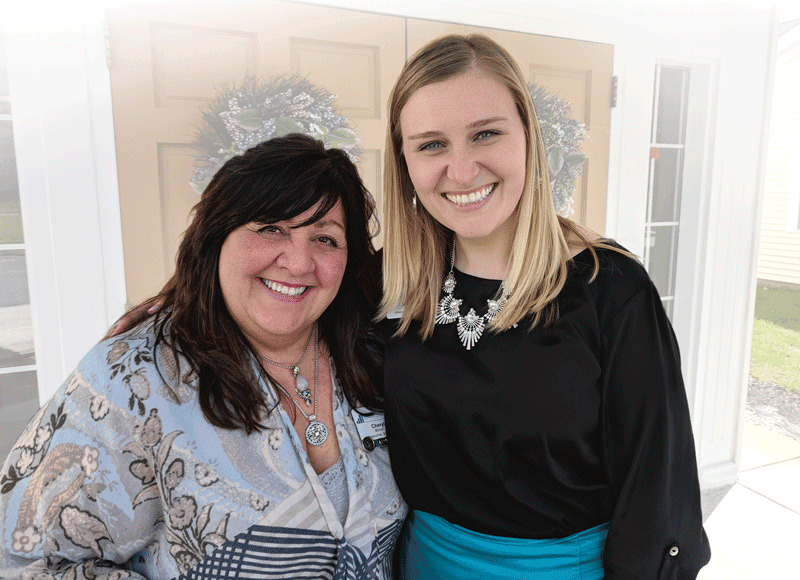 Allison Baker (right, with Cheryl Moran) says everything from the Atrium’s programs to its physical layout caters to individuals with cognitive impairment.