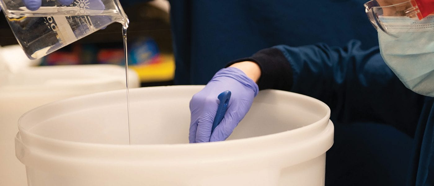 Theory Wellness staff make hand sanitizer