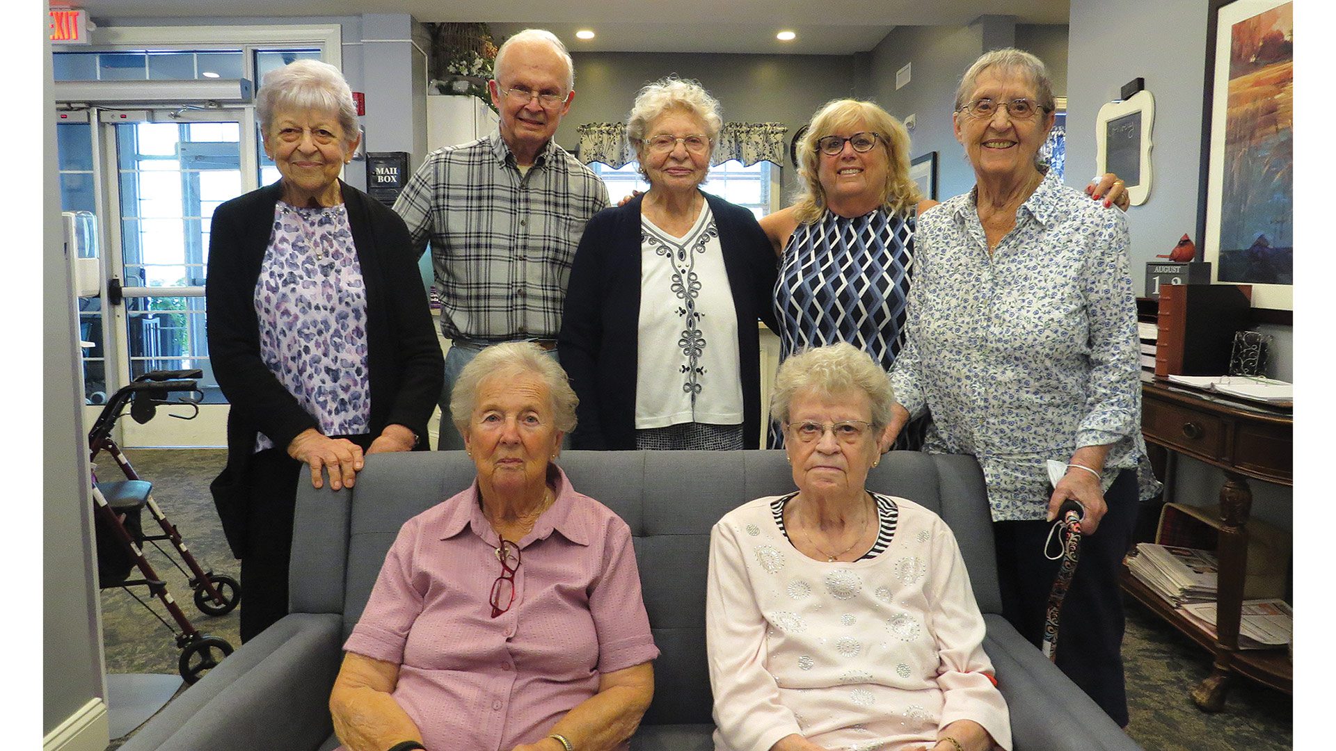 Beth Cardillo, seen here with several residents of Armbrook Village