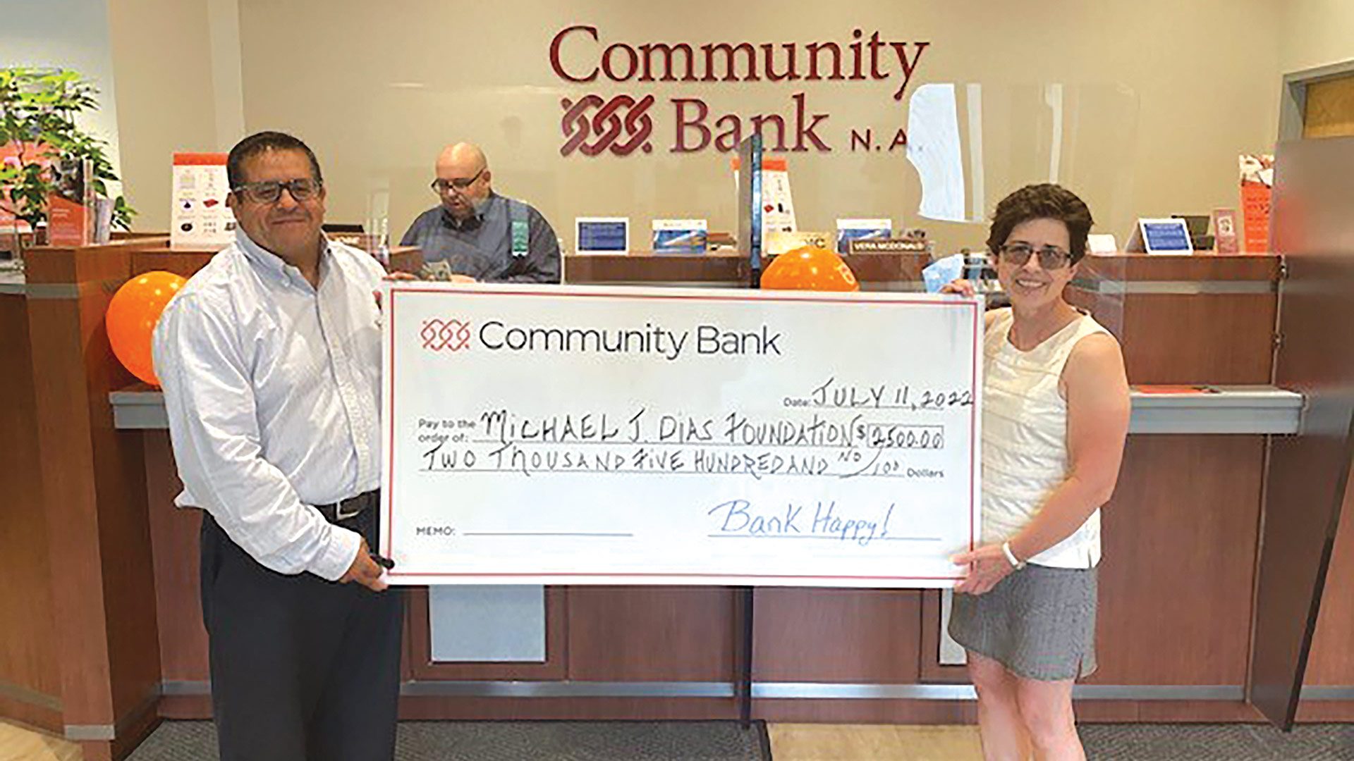 Community Bank Branch Manager Gilbert Nieves and Michael J. Dias Foundation Executive Director Karen Blanchard.