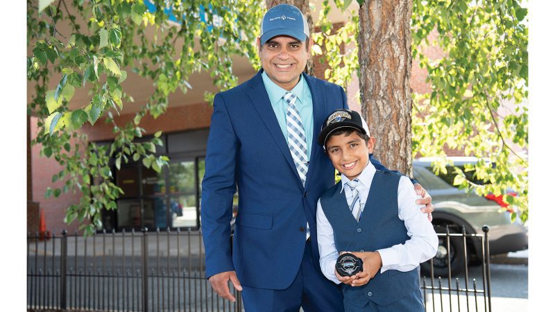 Dr. Sundeep Shukla, seen here with his son, Deven, is one of the team physicians for the Springfield Thunderbirds, one of the many ways he is involved in the community.