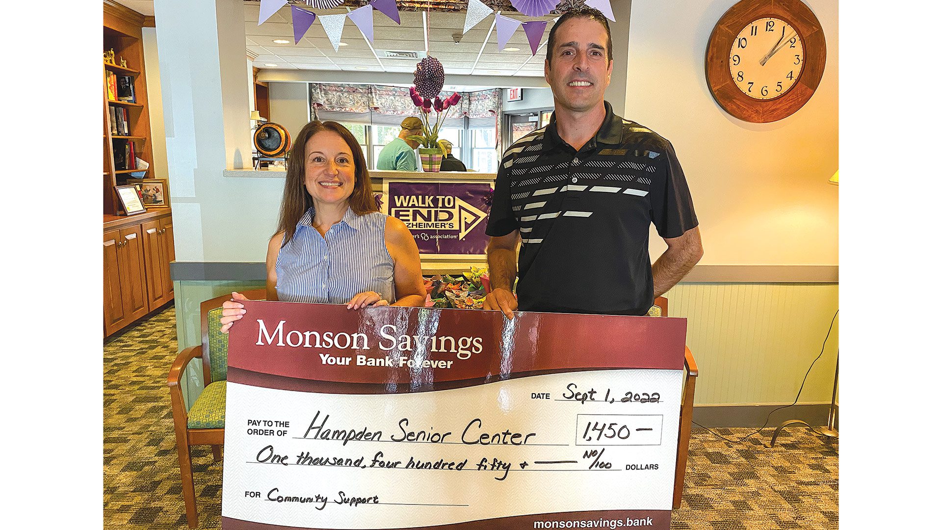 Pictured: Adriano dos Santos (right), Monson Savings Bank’s Hampden branch manager, delivers the $1,450 donation to Wendy Cowles, outreach coordinator for the Hampden Senior Center.
